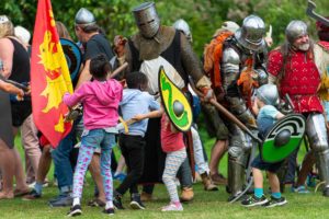 children fighting knights at arundel castle jousting event