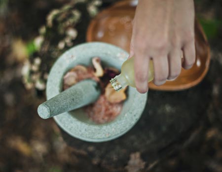 A lady making a healthy remedy