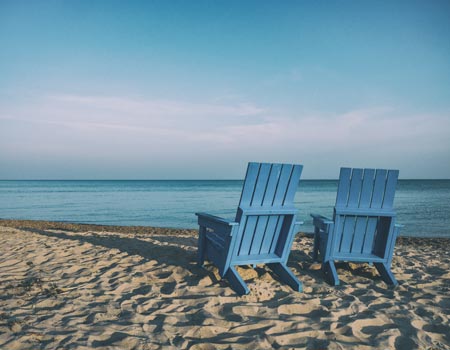 Two blue chairs representing retirement