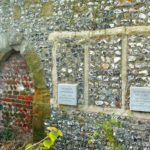 Blocked up doorway and window on the west side of St Nicholas Churchyard. Possibly the remains of the Maison Dieu.