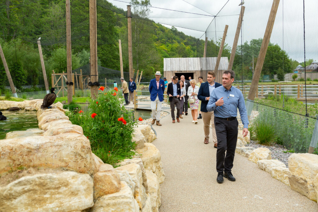 WWT CEO Kevin Perberdy leads a tour through the new aviary